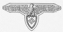 Popis: https://upload.wikimedia.org/wikipedia/en/thumb/a/ae/Freiwillige_Schutzstaffel_symbol.jpg/220px-Freiwillige_Schutzstaffel_symbol.jpg